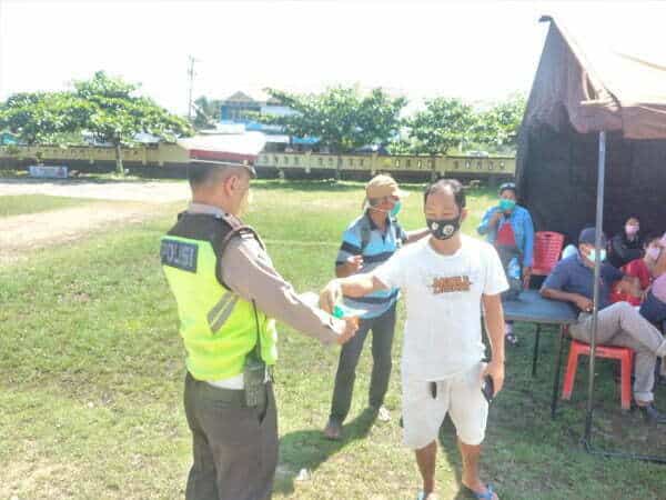 Satgas Operasi Patuh Polres Melawi Pantau Vaksinasi dan Bagikan Masker